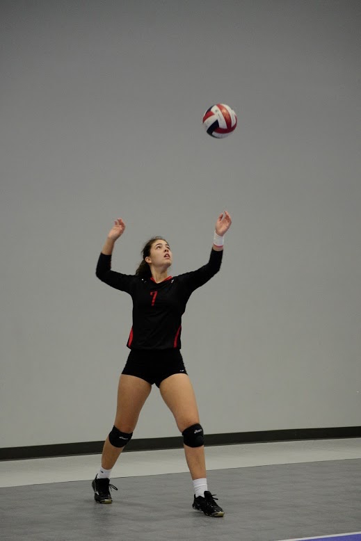 Junior Grace Hansen fires off a serve at the Houston Open Tournament at the Skyline Volleyball Facility. (Anudeep Jain)