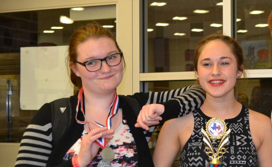 Juniors Iris Cronin and McKenna Gessner revel in their first place victories at French Symposium.