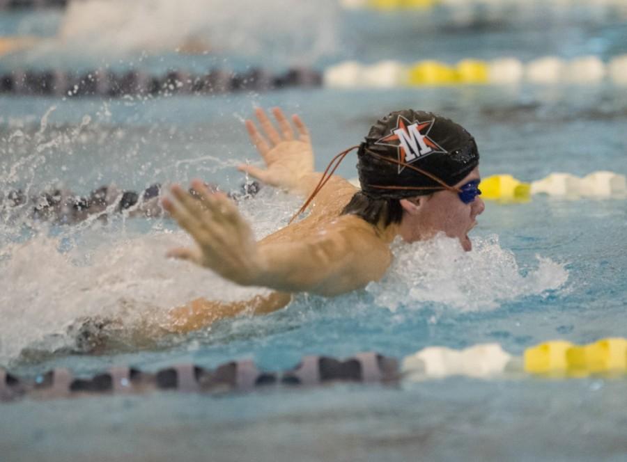 Senior captain Austin Allday takes a breath as he speeds down the lane at the team’s first meet at Lamar, Nov. 19.