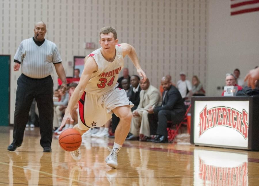 Senior Risher Randall takes the ball down the Liu Court during their final home game of the season, Feb. 4. The team defeated John Cooper 49-47.