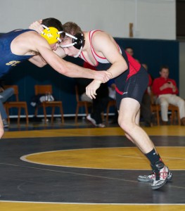 Senior captain Douglas Moody goes face-to-face with a St. Mark’s wrestler at last year’s SPC. This year, he is confident in another Maverick victory.