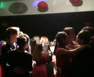 Students crowd the cafeteria for the annual freshman Valentines Dance. The  cafeteria is festooned with decorations.