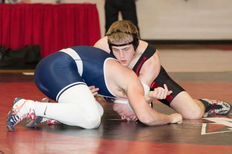 Senior captain Douglas Moody wrestles in Liu Court, where the SPC Wrestling Championships were held this year.