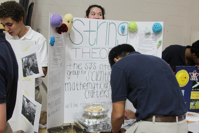 A student signs up for String Theory Club, an organization which knits and sews replicas of mathematical and scientific concepts.