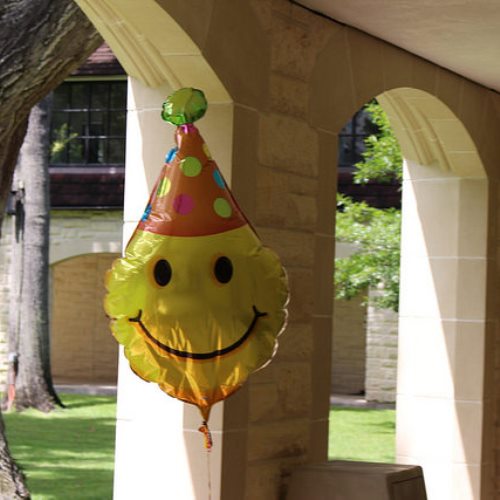 Surprises like this smiley balloon hanging in the Quad remind students of the simple joys in life. Groups like Wellness Club try to ease the stress of students, improve their state of mind and encourage healthy habits.