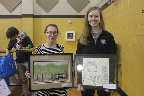 Shelby+Jordan%2C+freshman%2C+left%2C+and+sophomore+Grace+Vincent+submitted+Louisiana-inspired+artwork+in+the+color+pencil+and+pencil%2Fcharcoal+categories.