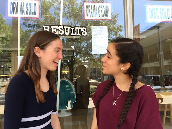 Freshmen Josephine Dodd, left, and Juliana Aviles, right, check results for the second round in the Drama Group category. Their drama group, which included six other students, won first place in the beginning drama category for their scene from the absurdist play Rhinoceros.