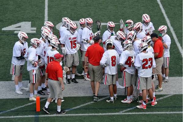 Pictured is the lacrosse team during spring break at Washington and Lee University, where the Mavericks played two teams from Virginia. Head Coach Sam Chambers stands in the center.