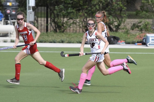 Mavericks JV players run over the new wet-turf field in a game against St. Andrews.