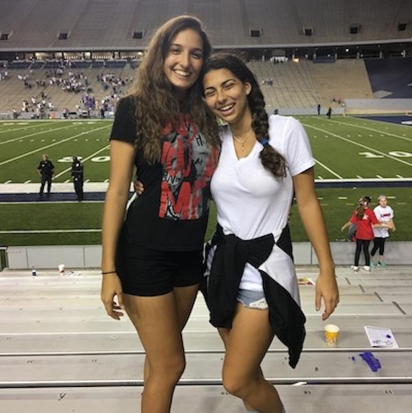 Barbara and sophomore Sara Lichtarge enjoy the homecoming football game.