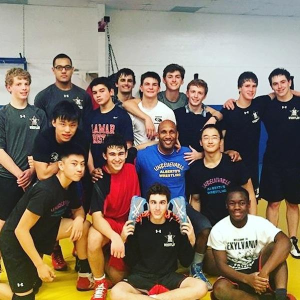 Pictured is Rodriguez with his club wrestling team in 2015, which includes many athletes from St. Johns.