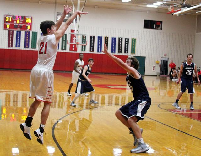 Senior Daniel Perrier, left, plays at the Emery Weiner game at Liu Court.