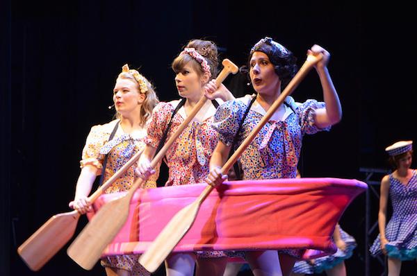 From left: junior Katy Shafer, Sophie Clayton and Abigail Moorhead (both seniors) perform the number In the Same Boat, a song in the fictional show Robbin Hood.