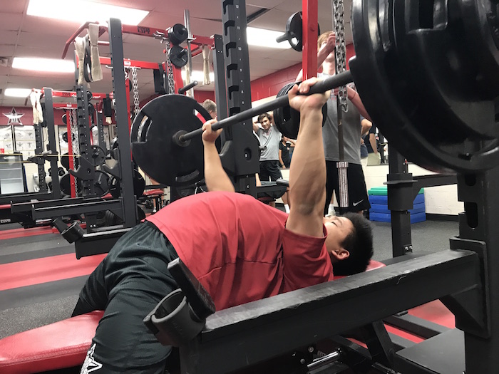 Senior Ben Kang dedicates time every day to lift as much weight as possible.