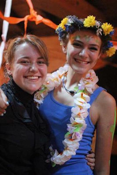 Andrews (right) dressed up as a flower with her friend dressed as Marie Curie at Rockbrook's Banquet. 