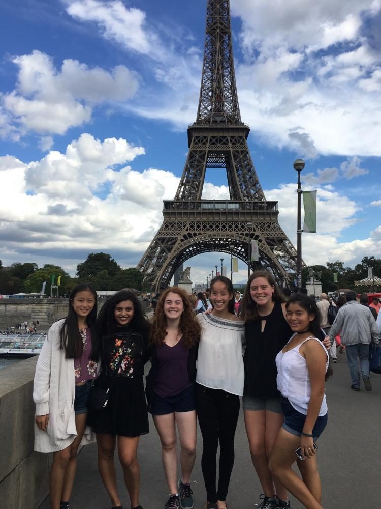 From left: Juniors Emily Feng, Mariela Arreola, Juliette Draper, Elizabeth McNeely, Caroline Burnett and Carlee Marquez stand in front of the Eiffel Tower.