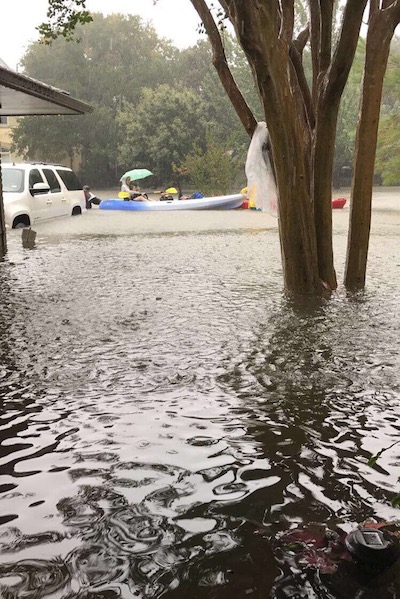 Some residents resorted to kayaking to safety once water flooded their cars.