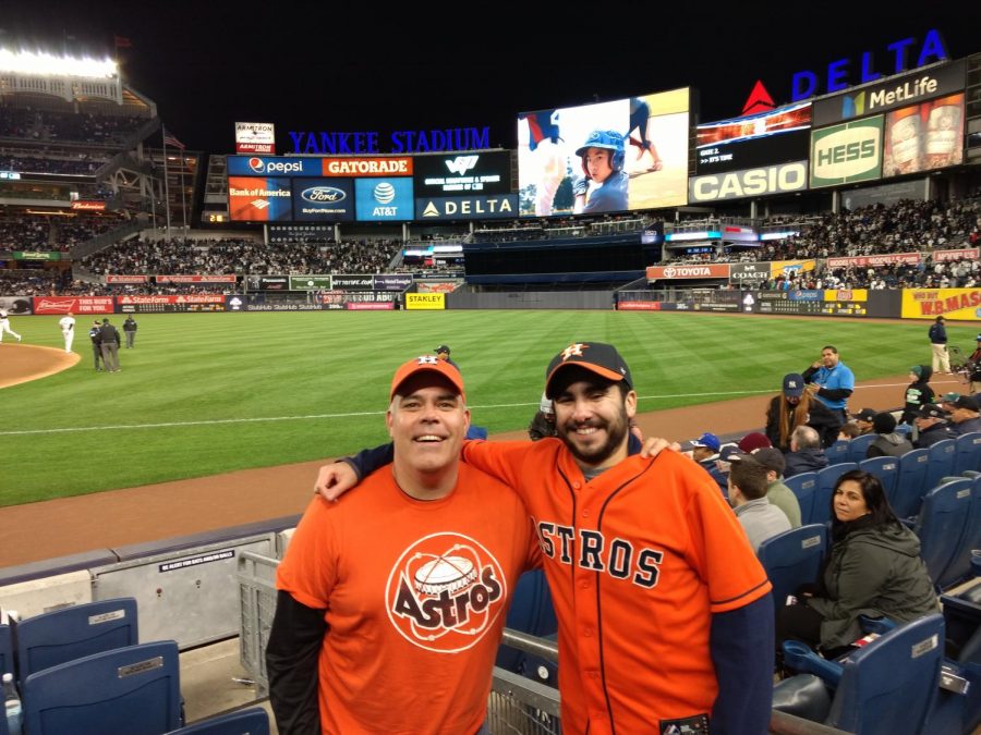 Director of Experiential Education Marty Thompson and Andrew Sobotka (11) watch Game 3 of the ALCS at Yankee Stadium. 