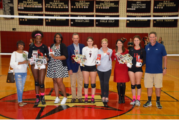 From left: Seniors Kennadie Jake-Turner, Grace Hansen, and Wallis Turley celebrate with their families.