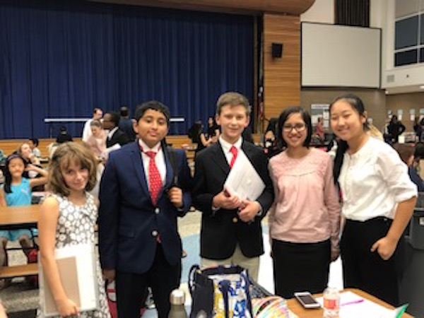 From left: middle schoolers Katya Bigman, Adam Moinuddeen, Nelson Mathis, Ananya Das, and Adele Wan have been debating with help from upper school debaters.