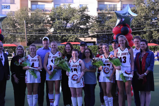 From left: Avery Morris, Audrey Ledbetter, Ellie Gershenwald, Mary Martha Maclay and Isabel Windham stand with their parents.