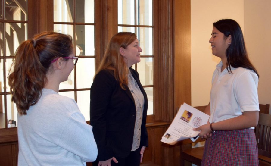 Lizzie Fletcher talks with students after her presentation. 