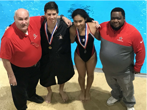 Coach Ron Raper, senior Henry Philpott, freshman Cai Flowers and Diving Coach Gamal Jones celebrate the diving teams first place finish.