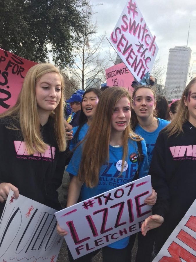 From left: Freshmen Emma Hamilton, Rachel Kim, Piper Edwards, Rachel Tompson and Charlotte Curtin join a crowd of marchers.