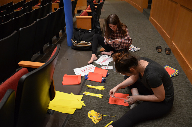 Seniors Emily Ragauss and Hannah Cohen create posters for the cast and crew.