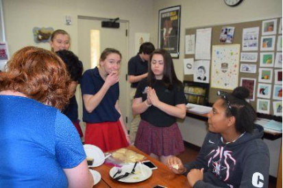 From left: juniors Shelby Jordan, Lauren Harpold and Gabriela Long sample different cheeses.