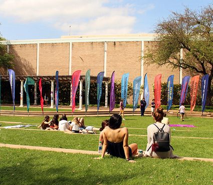 Students relax on the grass outside Hockaday.