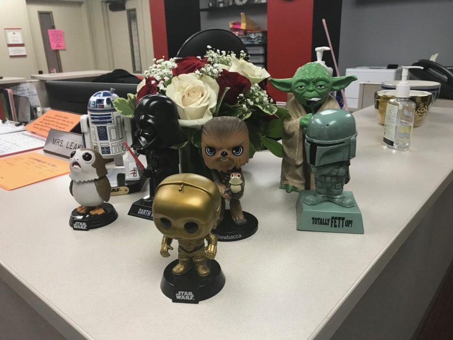 Mrs. Leakey has collected several Star Wars bobbleheads during her time in the Administration office.