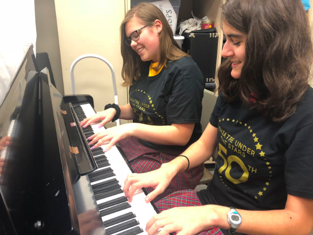 Sophomores Gabrielle Solymosy and Leena Hanson helped the kids practice the songs for their performances.