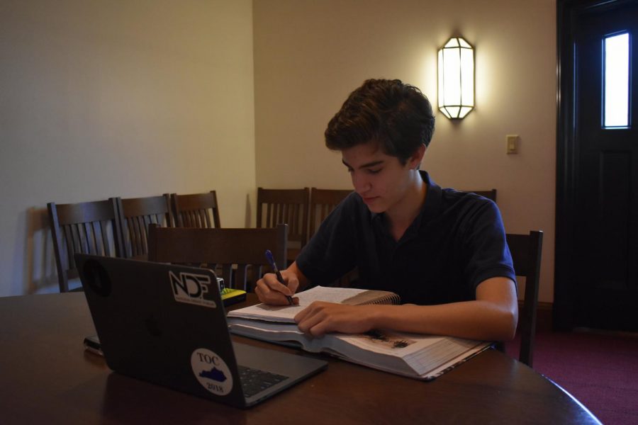 Junior Asher Moll takes advantage of the quiet study space to finish his homework.