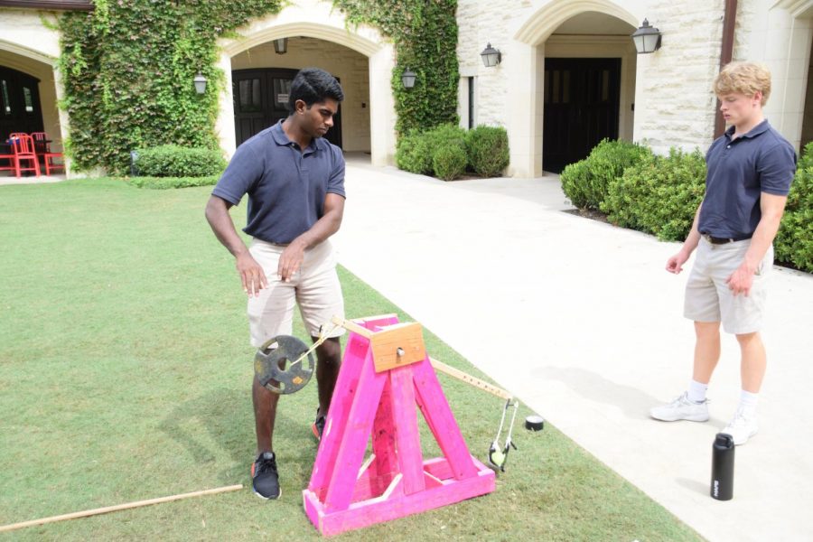 Trebuchet Trial: seniors Prithvi Krishnarao and Cameron May test their trebuchets range as part of their Physics II (H) project.