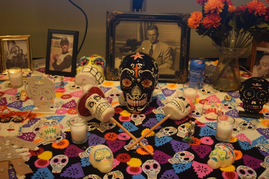 Sugar skulls, photographs and other objects covered the ofrenda outside of the Glassell Gallery.