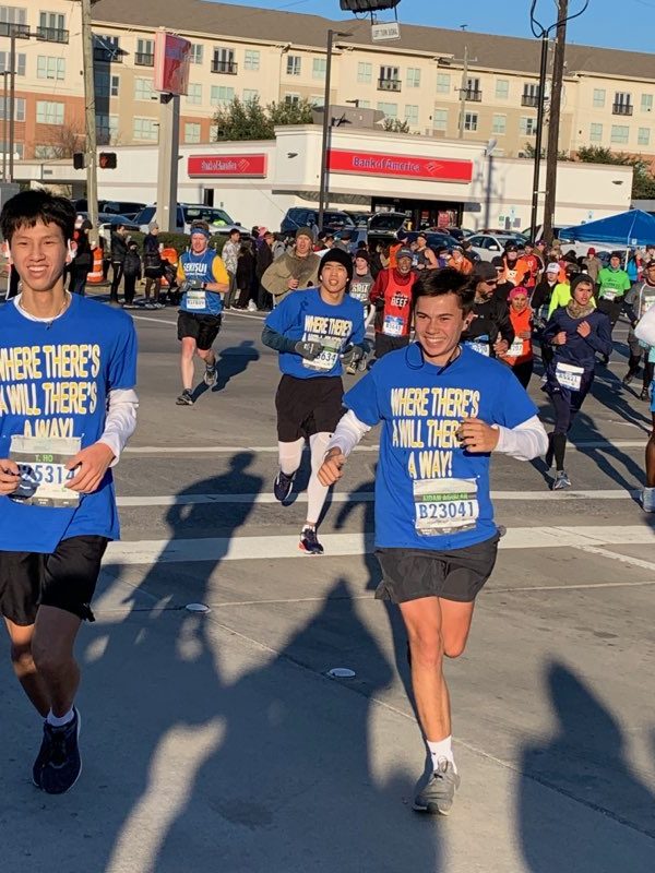 Ho, Chang and Aguilar run past spectators cheering Wills name.