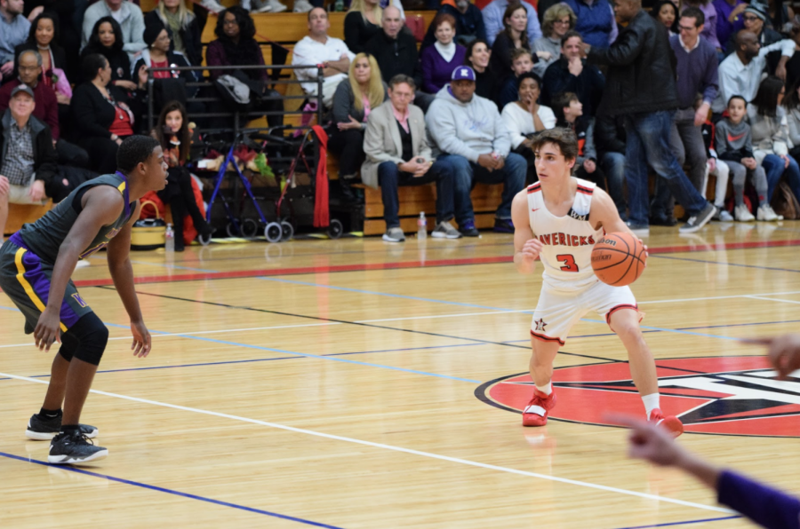 Junior+captain+Isaac+Blue+drives+to+the+basket.