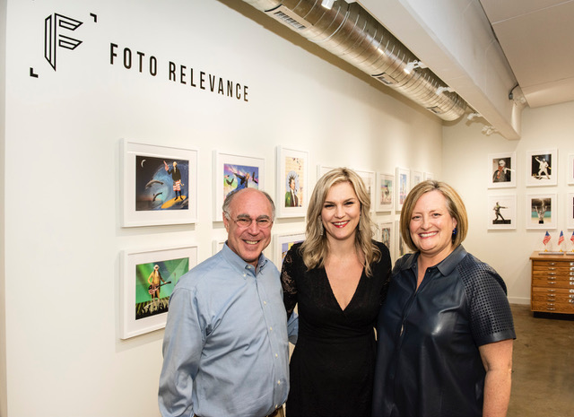 Bryn Larsen (right) and Geoffrey Koslov (left) open an exhibit featuring portraits by Houston-based photographer Julia McLaurin (center).