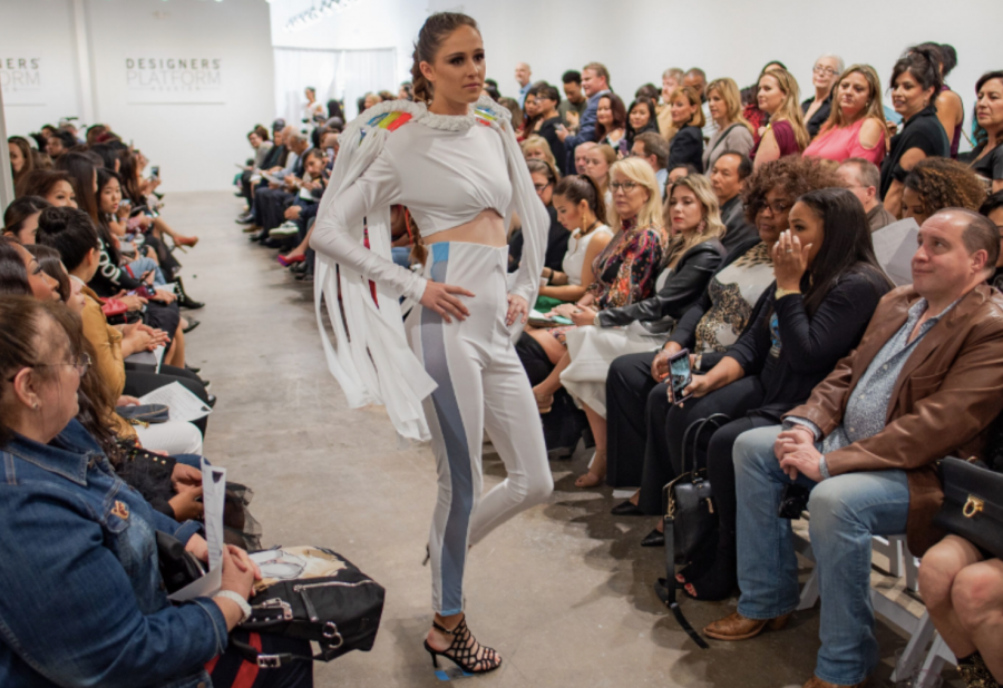 Students walk the runway at a local fashion show