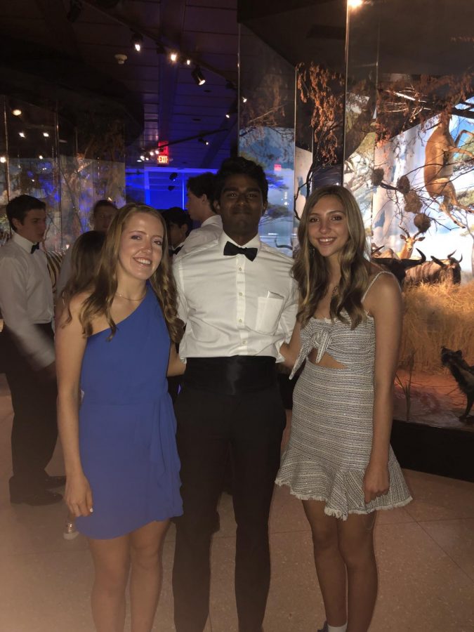 Senior Design Editor Prithvi Krishnarao and Assistant Design Editors Amélie Perrier and Siena Zerr pose in the Frensley/Graham Hall of African Wildlife exhibit.