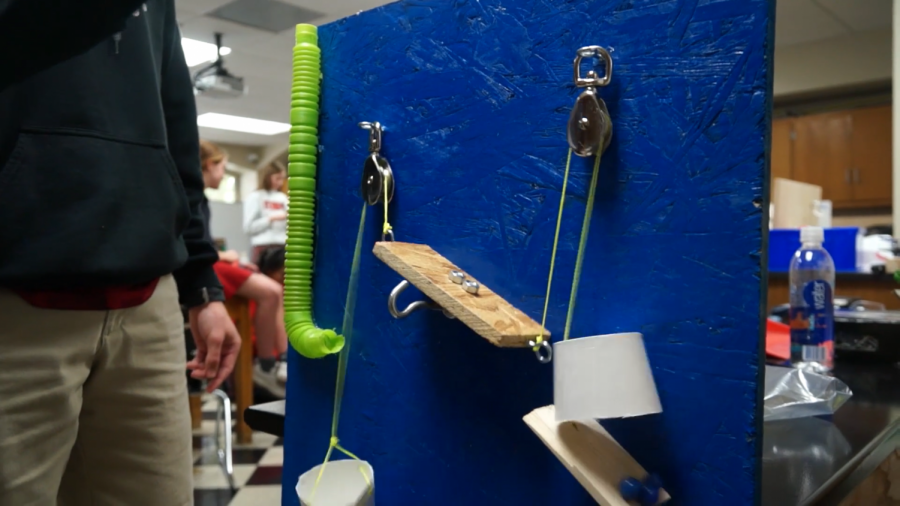 Physics students test their Rube Goldberg machines.