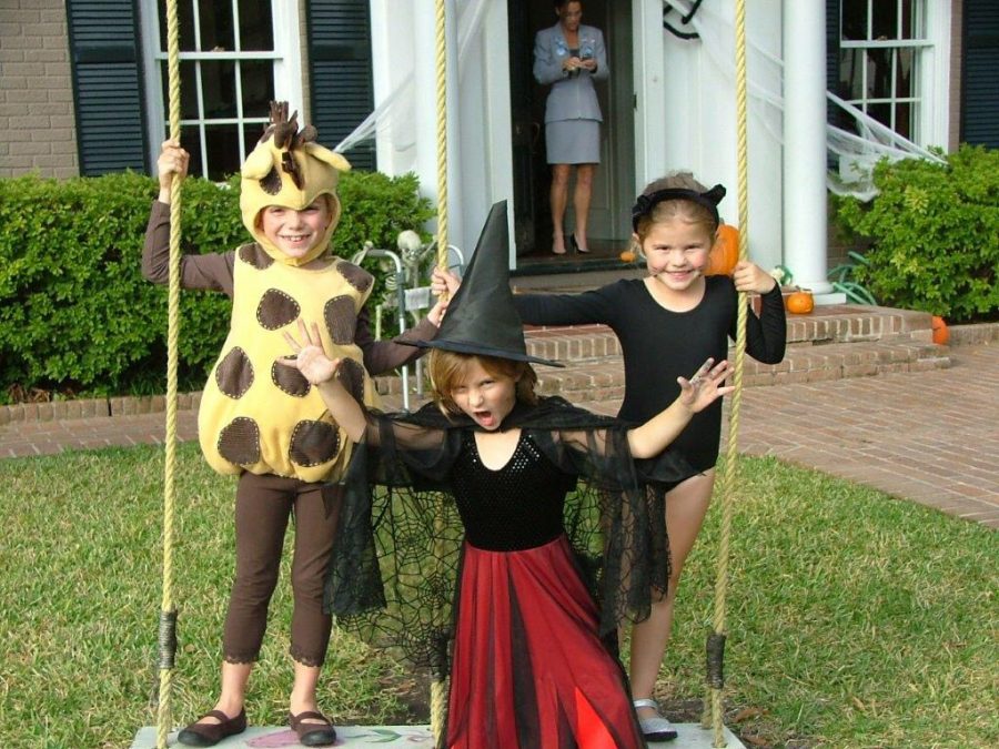 Grace Randall (middle) poses as a witch for the ninth year in a row.