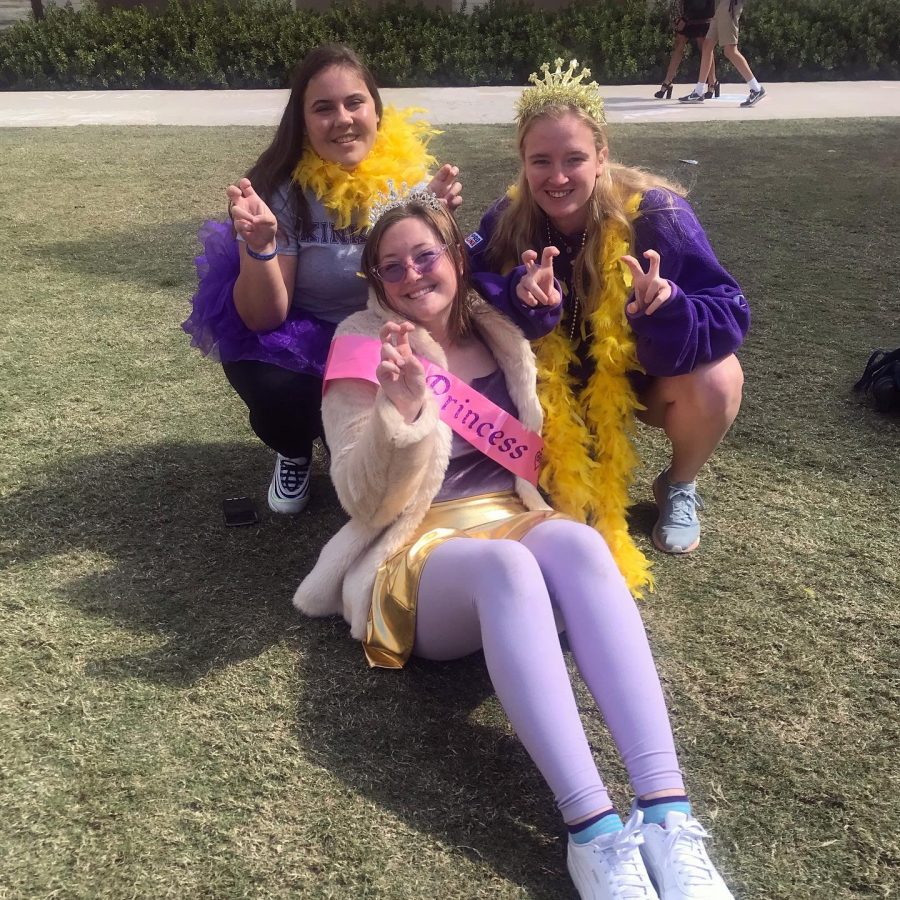 Senior girls accessorize with feather boas, tiaras and sashes to mock their rivals preppy stereotype.