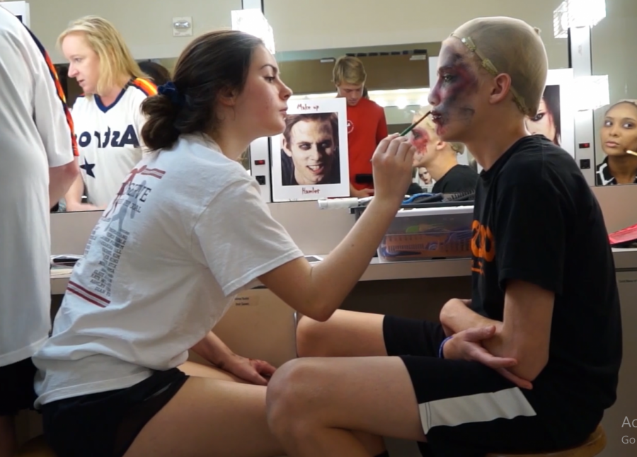 Freshman Ava Steely applies sophomore Alex Aitkens zombie makeup.