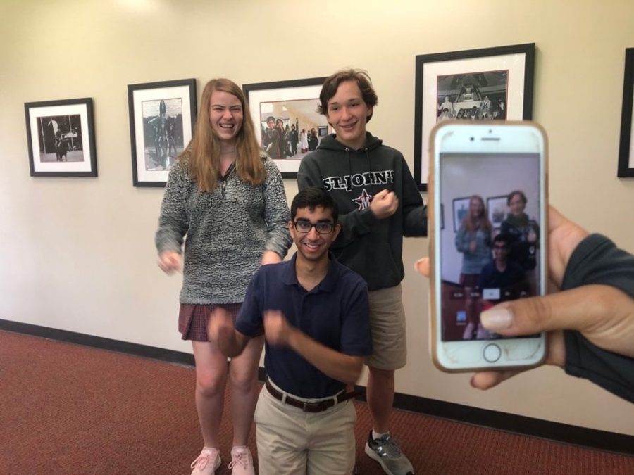 Juniors Julia Smith, Ethan Kinsella and Rahul Rupani dance for a TikTok.