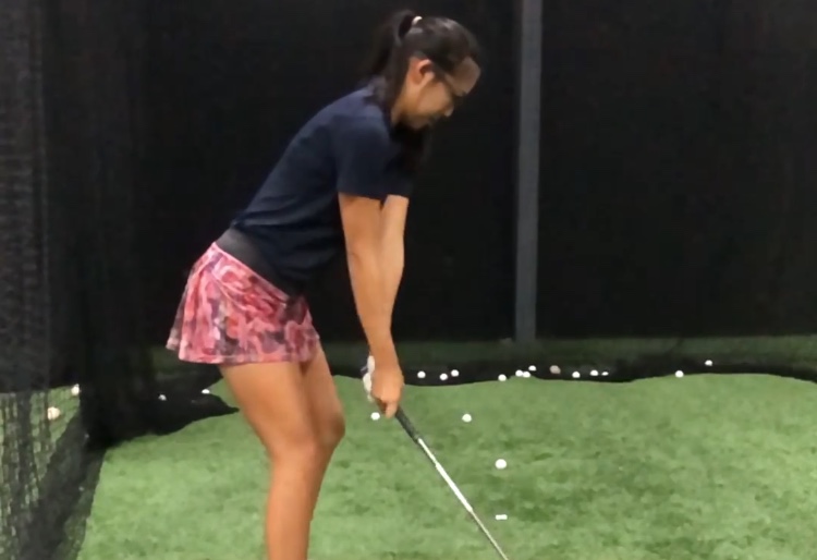 Senior Christine Wang practices in the batting cages. 