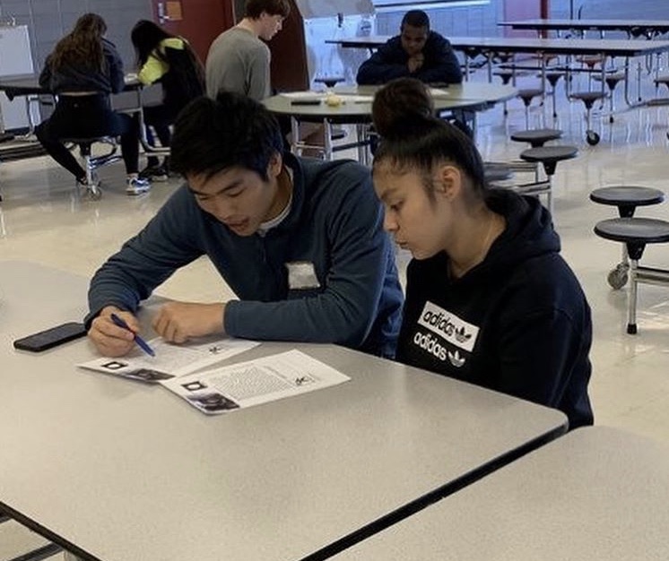 Junior Thomas Chang tutors a McReynolds student in reading. All McReynolds students have connections to the criminal justice system.