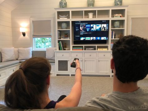 Junior Bailey Maierson and her brother Eli Maierson (19) choose a movie to watch. 