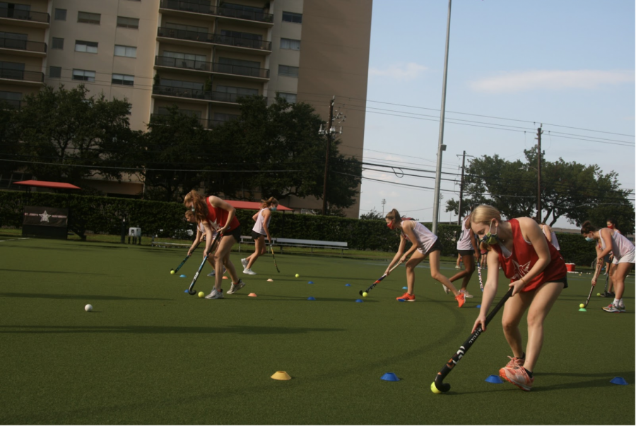 The field hockey team participates in a drill on Finnegan Field.